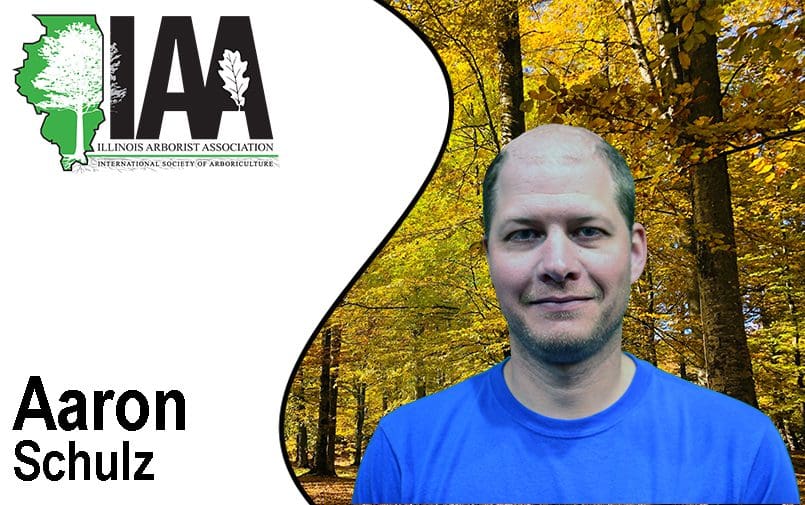 Man in blue shirt with IAA logo